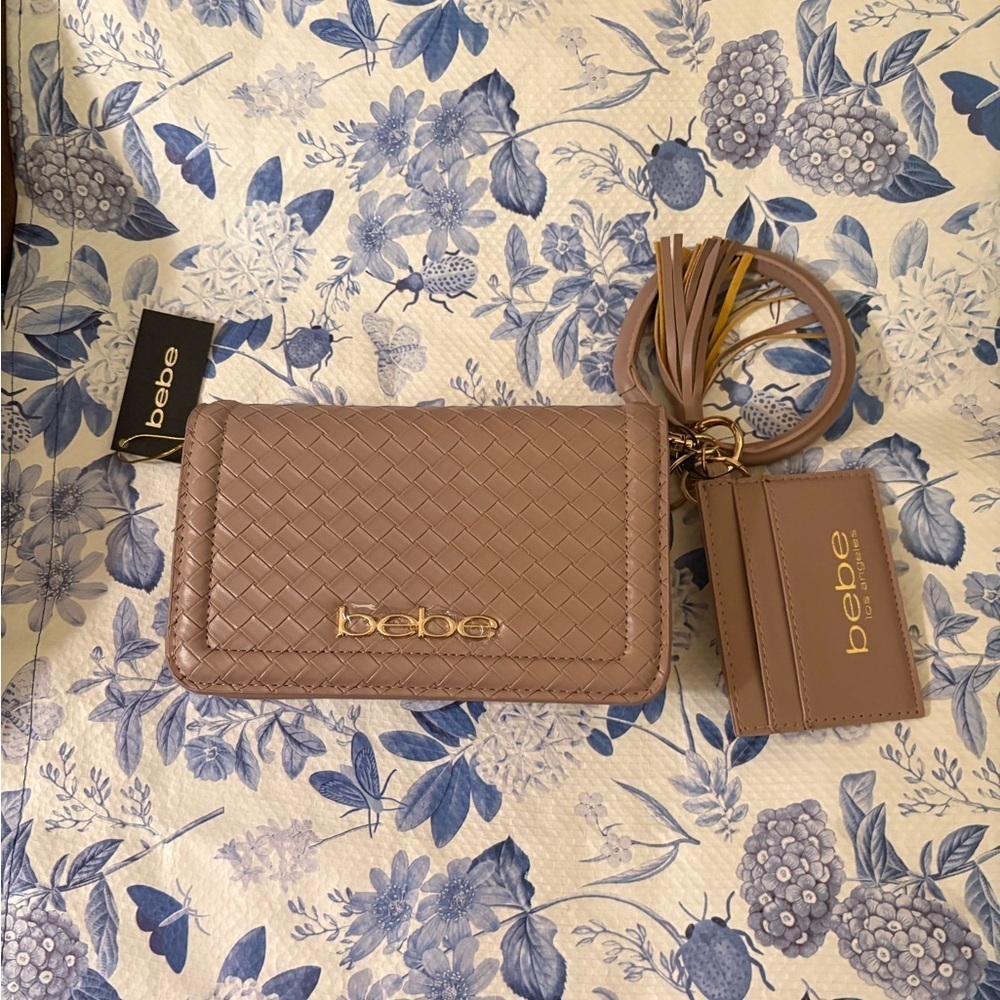 Bebe dusty rose detachable strap bag with wrist band as well snap close , zipper